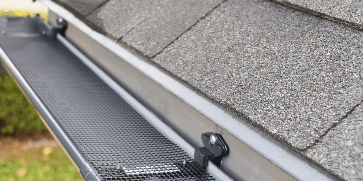 A gutter guard is shown on the side of a roof.