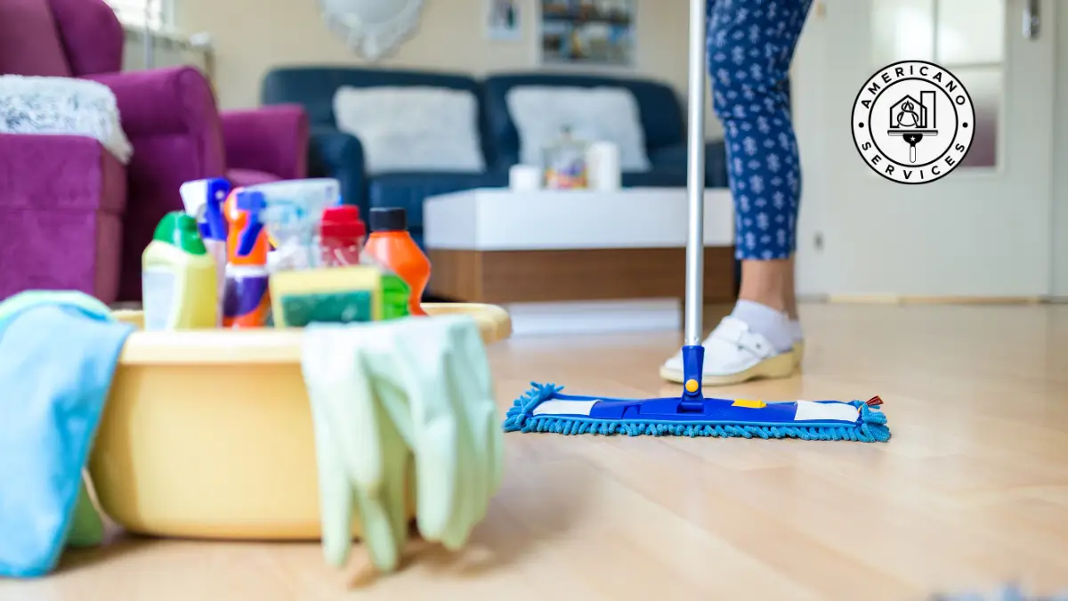 A person is cleaning the floor with a mop.