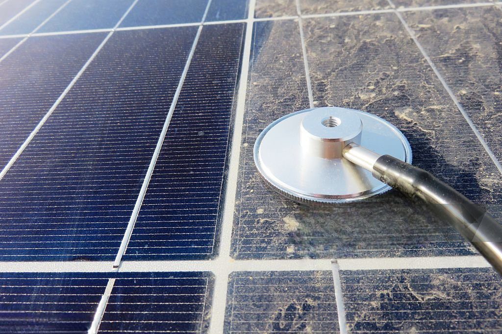 Stethoscope checking a solar panel.