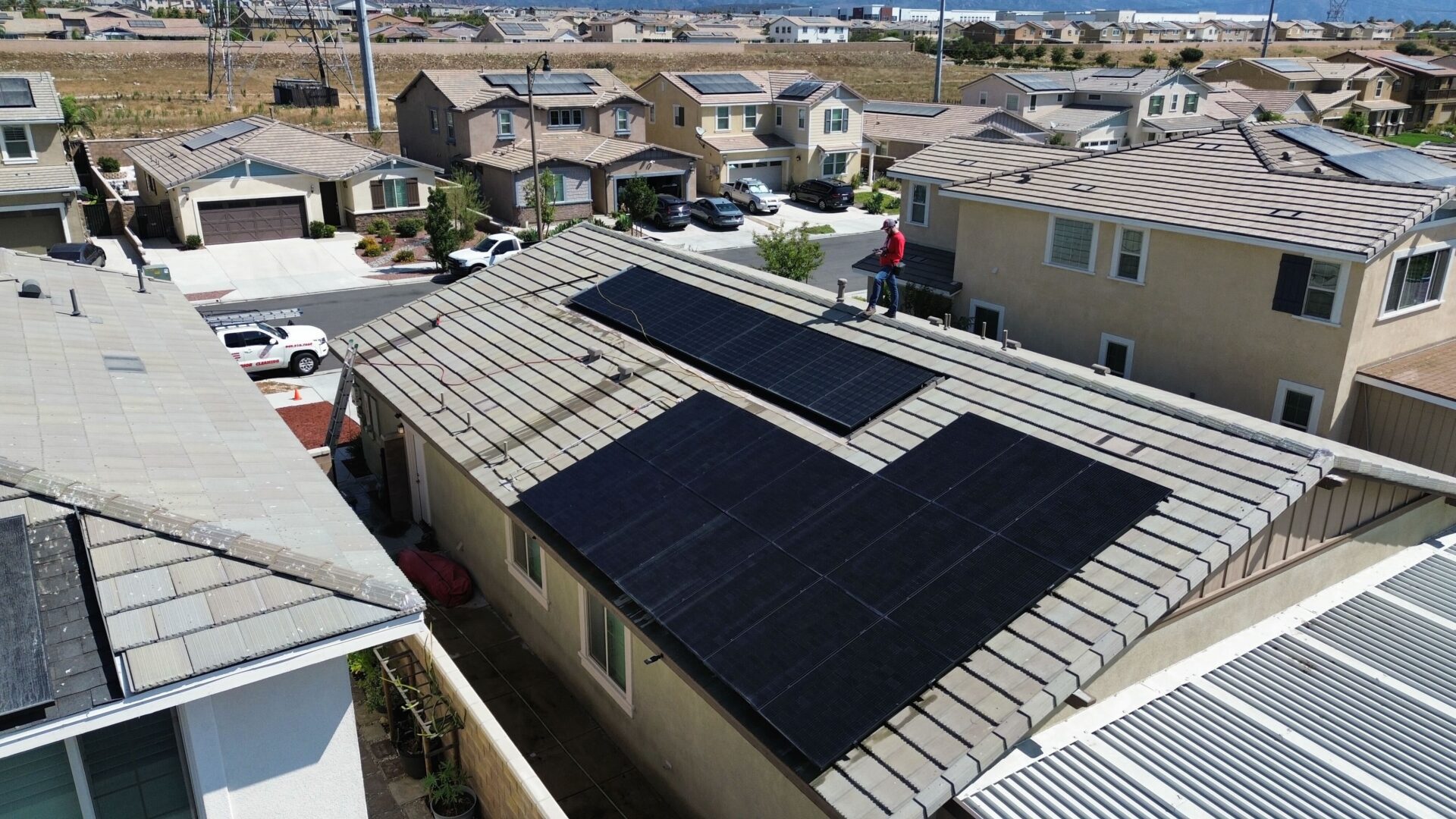 Aerial view of a house with solar panels.