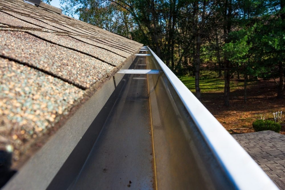 Close-up of a clean gutter on a roof.