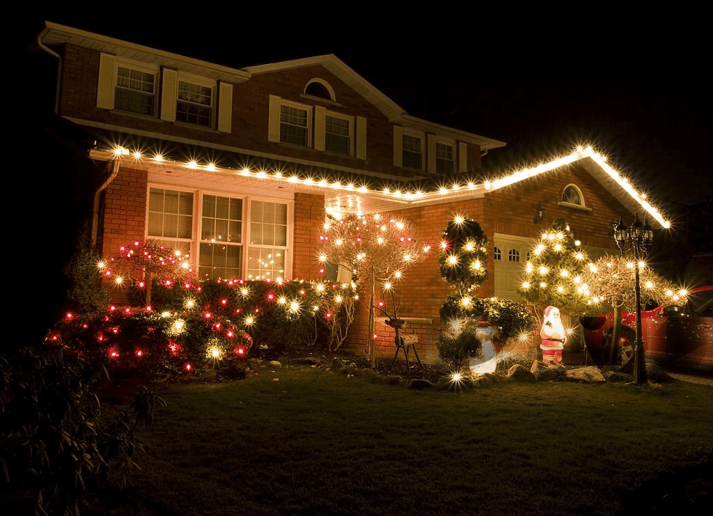 Christmas lights on a house and yard.