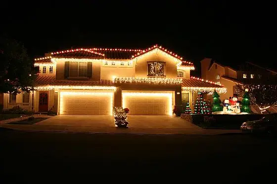 Christmas lights on a house at night.